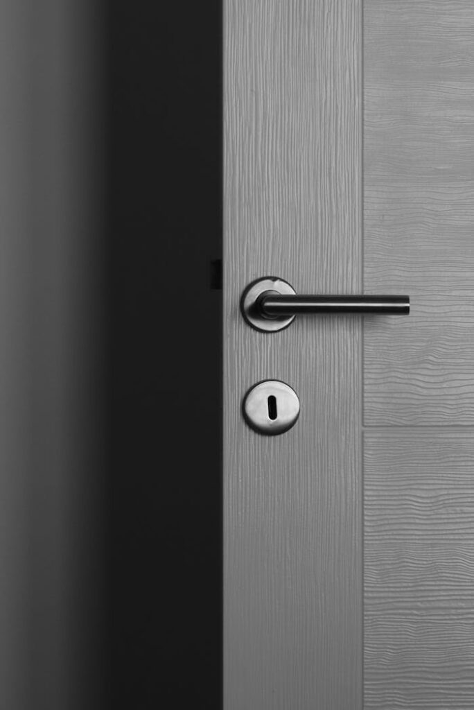 A Gray Wooden Door With Door Lever