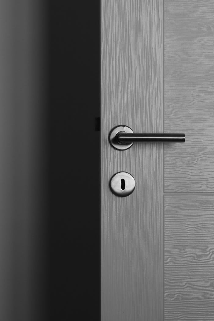 A Gray Wooden Door With Door Lever